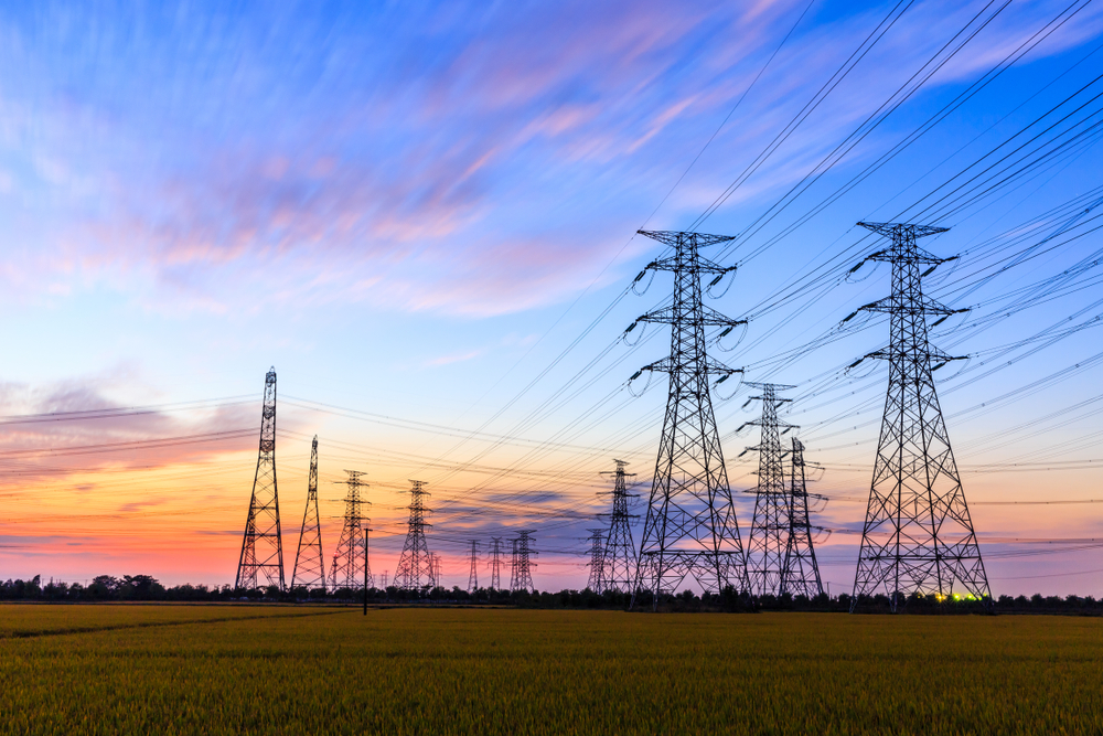 electric transmission lines against sunset