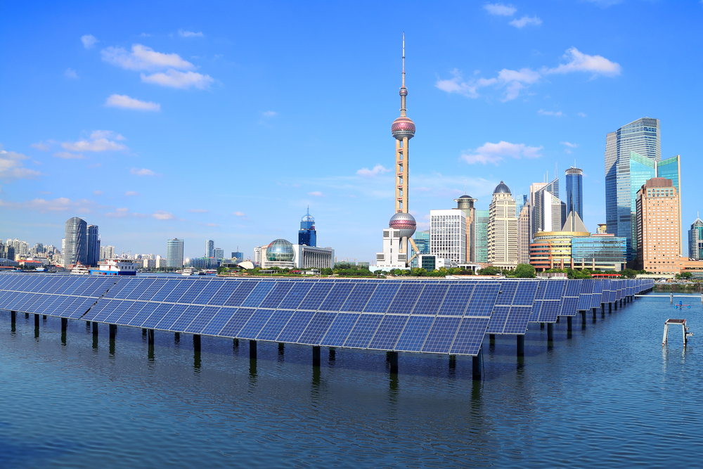 Shanghai Bund cityscape in China, solar panels in foreground