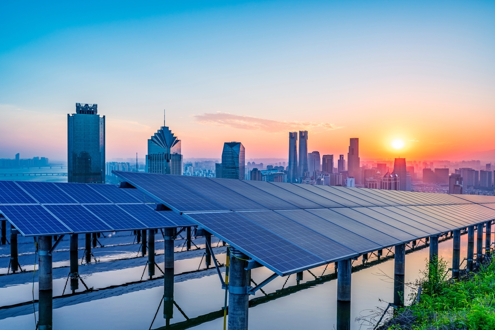 Despite Trump's Win Threatening Stormy Weather, this image shows sun rising over solar panels that power Shanghai in China
