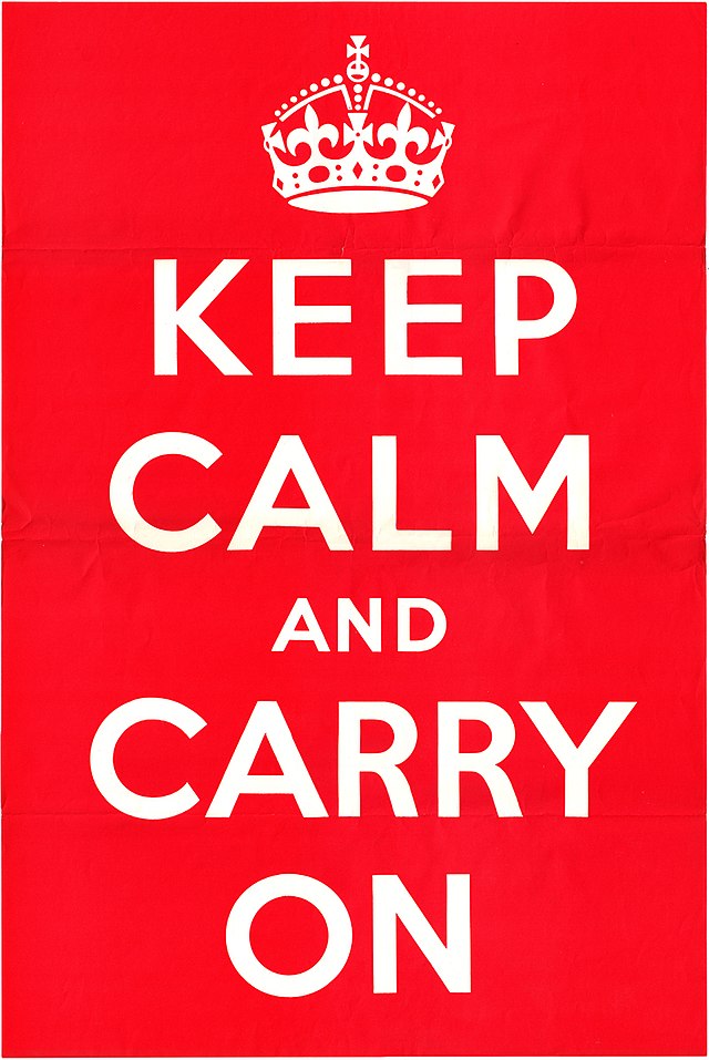 Poster with white text on red saying Keep Calm and Carry On
