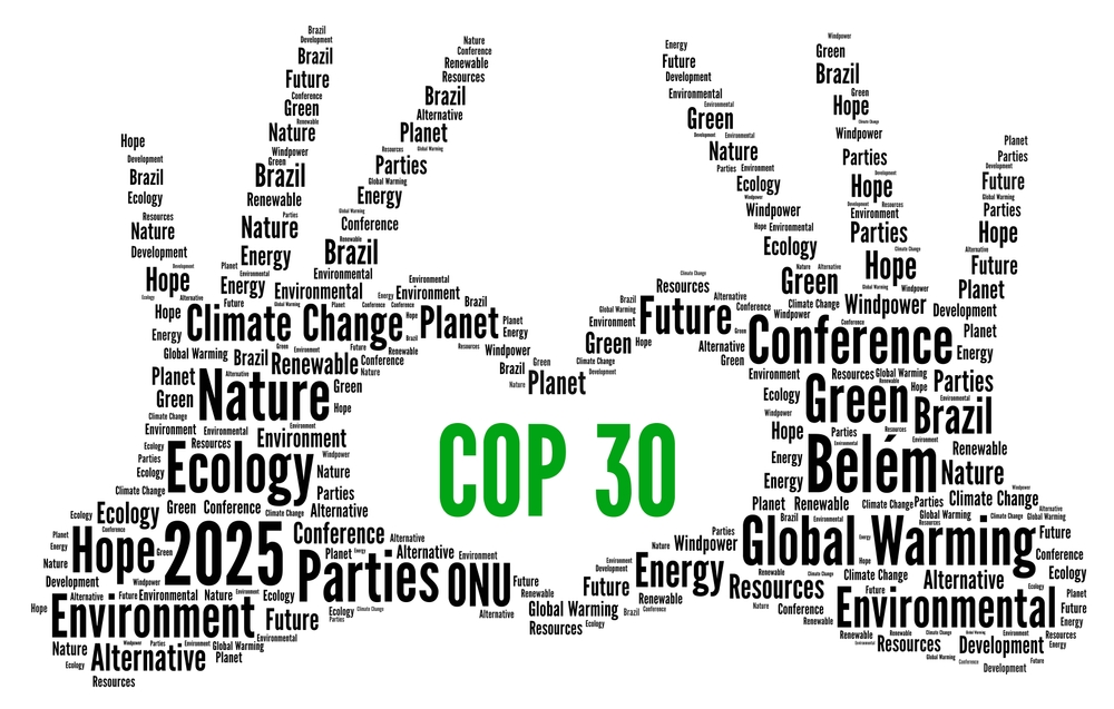 Graphic concept for COP30 global climate conference. Two hands made of words Climate Change, Hope, Green, Brazil, etc., form a heart with COP 30 in center.